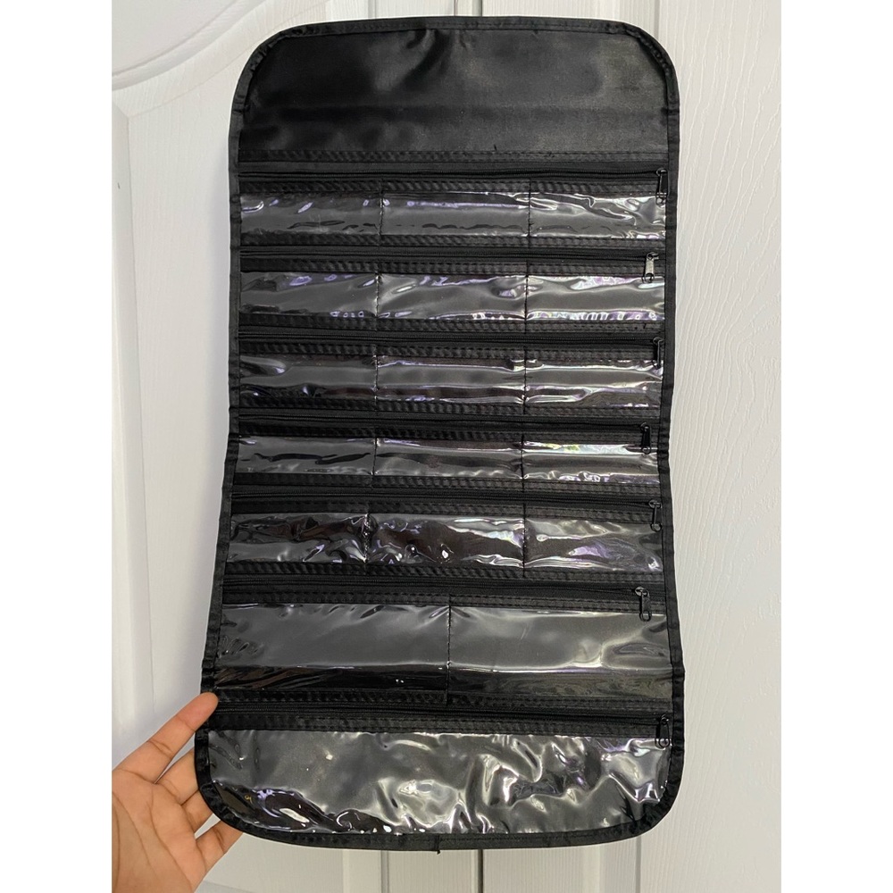 Hanging organizer with 38 total zip pockets.